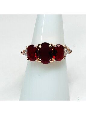 Ring Bomb Party Ring,  size 7, red stones, rose gold color band